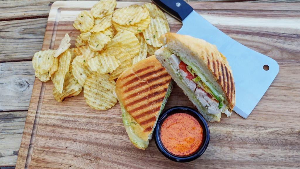 Chicken Pesto Panini · Grilled chicken, pesto, provolone, tomato, and sprouts. Add avocado for an additional charge.