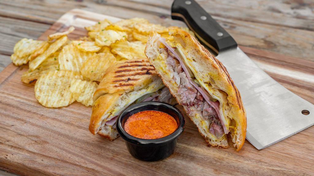Cuban Sandwich · Pulled pork, mustard, ham, pickles, and provolone cheese.