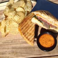 Steak Panini · Grilled steak, chipotle aioli, tomato, sprouts, caramelized onions and pepper Jack cheese. A...