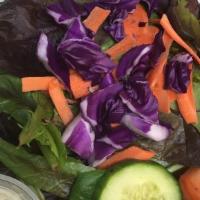 Organic Mixed Green Salad · Organic mixed greens served with tomato's , cuke's , red cabbage, and carrots with your choi...