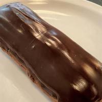 Chocolate Eclair · Pâte à choux filled with a smooth chocolate custard, iced with Fondant.