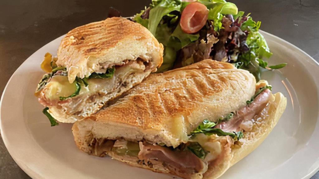 Brie Bartlet Panini · Prosciutto ham, brie cheese, caramelized onions and pears, olive oil, balsamic vinegar, roasted garlic, arugula