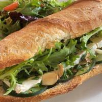 Brie & Herb Baguette Sandwich · Baguette, double creme Brie, fresh herbs, frisee green leaves, cucumbers, toasted sliced alm...
