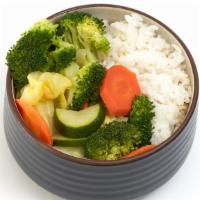 Veggie Bowl · A medley of steamed veggies (cabbage, zucchini, broccoli, &.  carrots) served on a bed of ri...