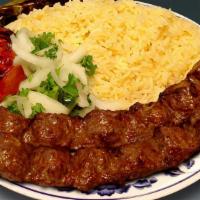 Beef Lula Kebab Plate · Beef lula kebab with rice, a side salad a roasted tomato and jalapeno.