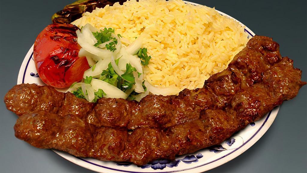 Beef Lula Kebab Plate · Beef lula kebab with rice, a side salad a roasted tomato and jalapeno.