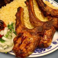 Lamb Chops · With rice, a side salad a roasted tomato and Jalapeno.