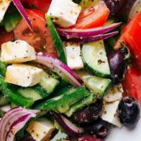 Greek Salad · Tomatoes, cucumbers, onions, feta cheese and olives and dressed with salt, pepper, Greek ore...