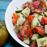 Armenian Fresh House Salad · Cucumber, tomatoes, onion, green peppers and our secret seasoning.