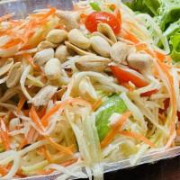 Papaya Salad With Sticky Rice  · Slices of green papaya, carrots, cherry tomatoes, peanuts and thai chili peppers, mixed with...