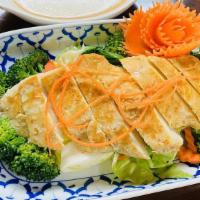 Lemongrass Chicken  · Steamed broccoli, carrots, cabbage and lemongrass marinated chicken topped with peanut sauce...