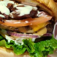 Monster Burger · Beef Patties, Cheddar & Swiss Cheese, Bacon, Pastrami, Turkey, Tomato, Onion, Lettuce
