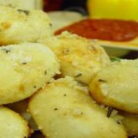 Garlicbombs · Fresh baked Sourdough smothered in Garlic Infused Olive Oil. seasoned with Parmesan Romano C...