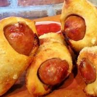 Olidunks · Italian Sausage wrapped in Sourdough and baked, drizzled in. Garlic Infused Olive Oil, sprin...