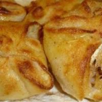 Apple Sourdunks · Four hand made sourdough pastries filled with cinnamon apples, cream cheese, almonds, and co...