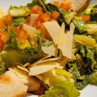 Caesar Salad · Romaine, tomatoes, shaved parmesan cheese, home made caesar dressing