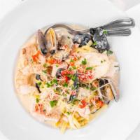 Northwest Seafood Fettuccine · Bay shrimp, prawns, clams, mussels, salmon, and cod in parmesan-garlic cream.