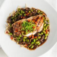 Sesame Salmon Rice Bowl* · Soy-sesame glazed salmon, coconut rice, stir fried vegetables and crispy soba.