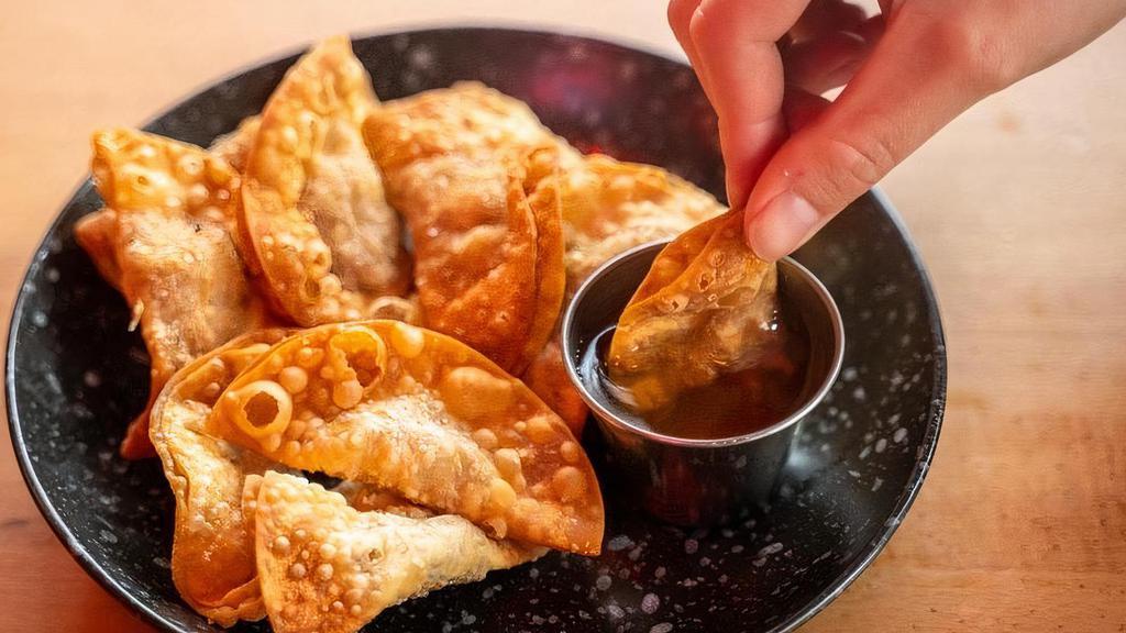 Crispy Wonton Wrappers · Deep fried egg wonton with minced pork, egg, and oyster sauce. Served with sweet chili dipping sauce.