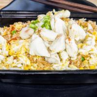 Crab Fried Rice · Crab meat, egg, onion, tomatoes, and carrots.