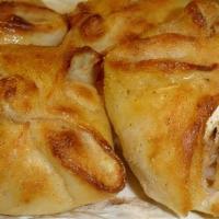 Apple Sourdunks · Four hand made sourdough pastries filled with cinnamon apples, cream cheese, almonds, and co...