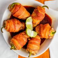 Toritos · Zesty yellow chili peppers stuffed with savory shrimp then wrapped in a bacon blanket. Add c...