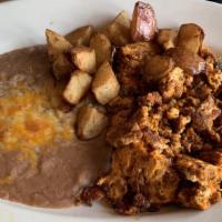 Chorizo Con Huevos · Scrambled eggs, spicy mexican sausage, served with house potatoes, beans and your choice of ...