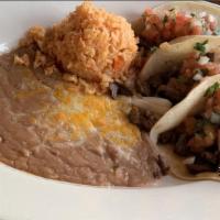 Carne Asada · Thinly cut steak, seasoned and grilled. Served with rice, beans, guacamole, pico de gallo an...