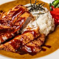 Katsu Curry Rice · Japanese style curry, pork cutlet and Japanese radish pickles over rice.