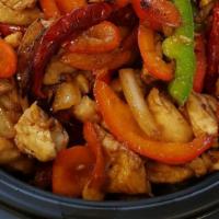 Chilli Chicken Plate · Tons of chicken tossed with roasted chilies served over white rice, bell peppers & onions (H...