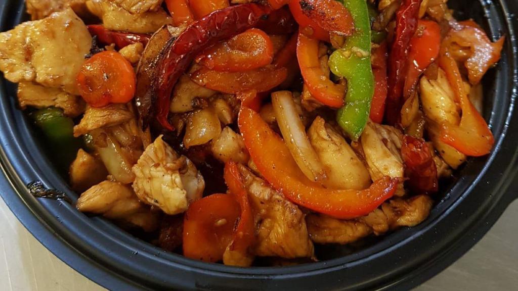 Chilli Chicken Plate · Tons of chicken tossed with roasted chilies served over white rice, bell peppers & onions (Heat = Mild)