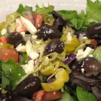 Greek Salad · Tomatoes, olives, pepperoncini, red onions, feta cheese, greens, lemon-oregano vinaigrette.