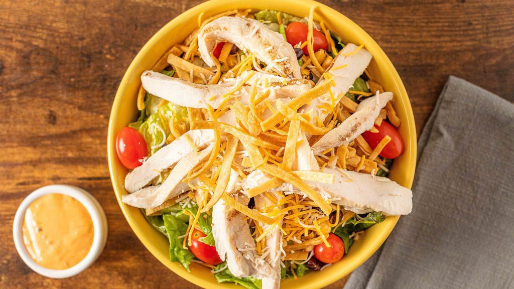 Southwest Chipotle Chicken Salad · Romaine & iceberg mix, grilled chicken, shredded jack cheddar cheese, black bean & roasted corn, black olives, grape tomatoes, and tortilla strips.  Try it with chipotle ranch dressing.