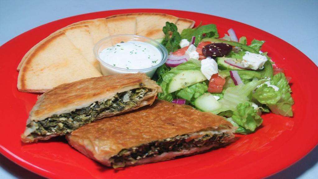 Spanakopita Plate · Spinach pie with Greek salad, pita bread, and tzatziki sauce.