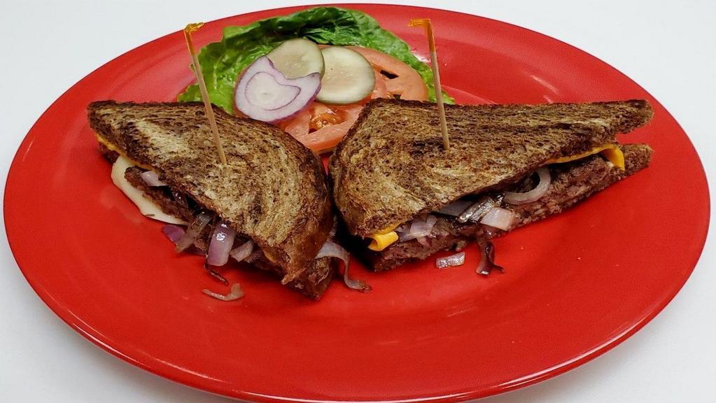 Patty Melt · Rye bread with American and swiss cheese, grilled onions.