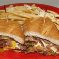 Beef Edelphia · This Sliced Beef Cooked in Au'jus Topped W/Swiss Cheese, Grilled Onions & Peppers and Served...
