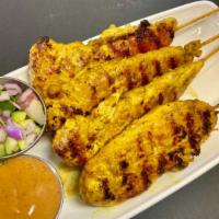 Chicken Satay (4  Skewers) · Grilled marinated chicken served with cucumber salad and peanut sauce