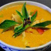 Panang Curry · Spicy. Panang curry paste, coconut milk, kaffir lime leaf, bell peppers, and basil.