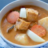 Massaman Curry · Spicy. Potatoes, carrots, onions, and massaman curry and peanuts.