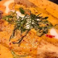 Crispy Trout Curry · Spicy. Deep fried whole trout topped with panang curry sauce, bell peppers and basil