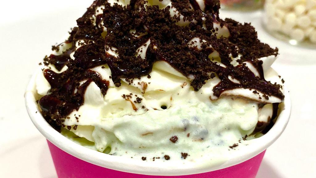 #2 Thin Mint Creation · This will make you wanna go out and join the Girl Scouts! Brownie Batter cookie dough, Mint Chip ice cream, homemade whip, chocolate sauce, and Oreo crumbes on top.