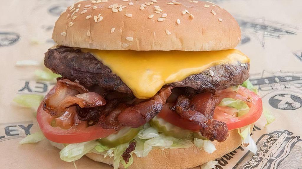 Bacon Cheeseburger · American cheese, bacon, KV spread, lettuce, pickles, and tomatoes. Made with 100% Fresh ground beef patties.