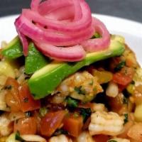 Spicy Shrimp Ceviche Tostada · Crispy tostada, spicy shrimp ceviche, fresh avocados, pickled onions.