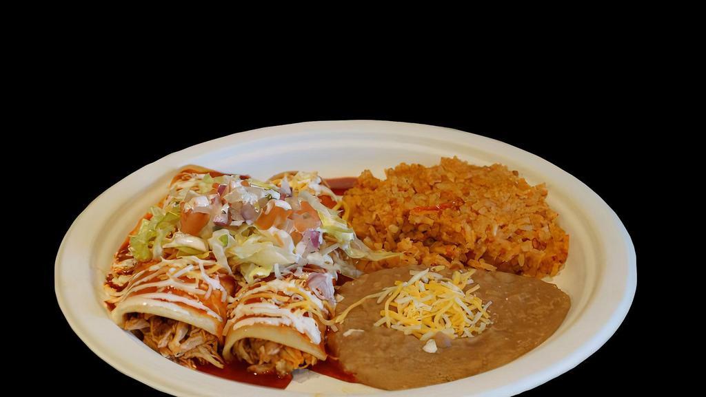 2 Enchiladas Plate · Two enchiladas topped with enchilada sauce, cheese, sour cream, lettuce, and pico de gallo. Comes with rice and beans.