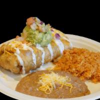 Chimichanga Plate · Deep fried burrito topped with cheese, sour cream, guacamole (guacamole made fresh with toma...