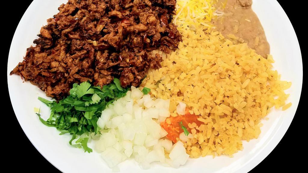 Al Pastor Plate · House marinated grilled pork served with rice, beans, onions, and cilantro.