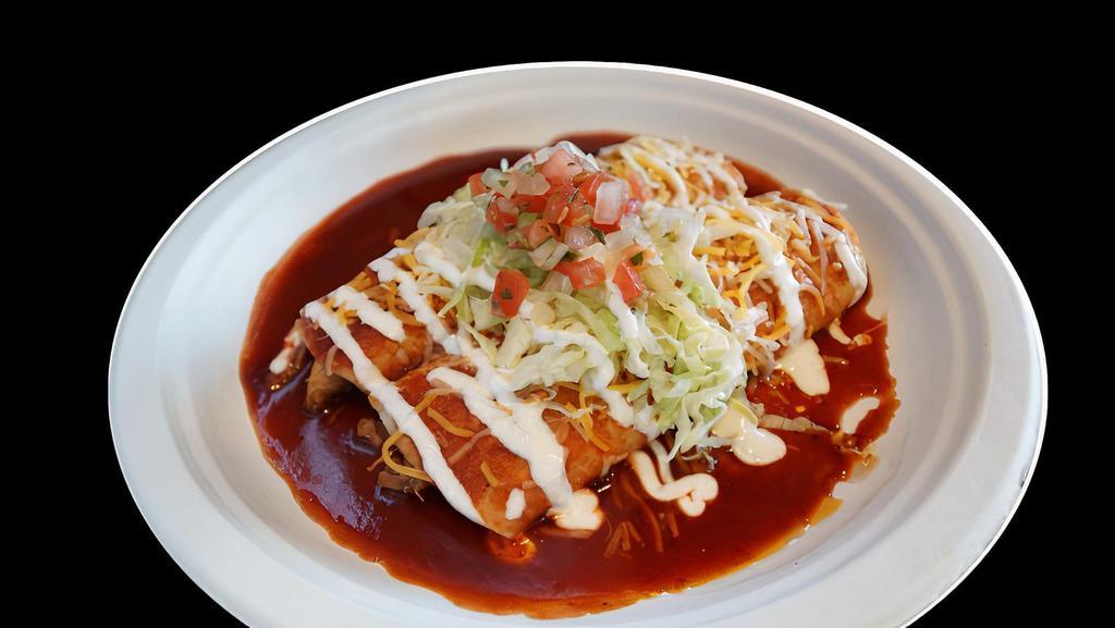 Side 2 Beef Enchiladas · Slow cooked shredded beef, enchilada sauce, cheese, sour cream, lettuce, pico de gallo.