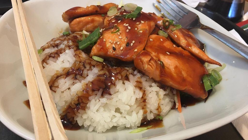 Teriyaki Salmon Bowl · Grilled Salmon with teriyaki sauce, comes with rice and steam veggies, eel sauce on top