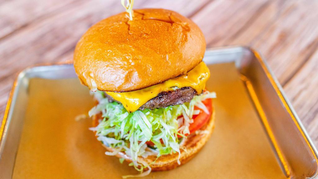 Craft Burger · American cheese, lettuce, tomato, caramelized onion, pickles and fry sauce. Add fries, salad, smoked bacon or fried egg for an additional charge.