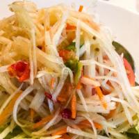 Papaya Salad · Shredded fresh green papaya, carrot, tomatoes, green beans and peanuts in our spicy lime dre...